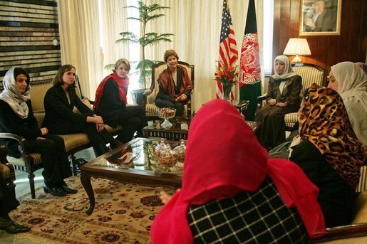 Laura Bush and Dr. Zenat Karzai, wife of President Hamid Karzai, center, join Paula Dobrianski, second from left, Under Secretary of State for Global Affairs, and Margaret Spellings, U.S. Secretary of Education, third from left, as they talk with Afghan women about issues of women's rights and education at the presidential residence in Kabul Wednesday, March 30, 2005. White House photo by Susan Sterner