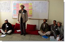 A man studying to be a teacher stands to introduce himself during a visit by Mrs. Bush to Kabul University in Kabul, Afghanistan, Wednesday, March 30, 2005. White House photo by Susan Sterner 