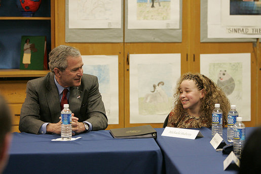 President Bush and 10-year-old Michaela Huberty exchange thoughts during a roundtable discussion Friday, April 1, 2005, at Paul Public Charter School in Washington DC. Michaela, a fourth-grader at Benjamin Mays Magnet School in St. Paul, Minn., is being raised by her mother while her father is in prison. As part of the President's Helping America's Youth initiative, Michaela joined the Kinship program in her hometown and gained a mentor, adding another positive adult in her life. White House photo by Eric Draper