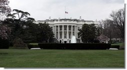 The American flag flies at half-staff Sunday after President George W. Bush ordered flags lowered as a sign of respect for the late Pope John Paul II, who died Saturday in Rome.  White House photo by Paul Morse