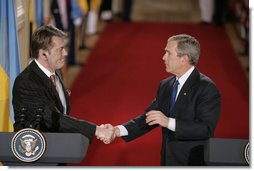 President Bush and President Yushchenko shake hands after a press availability Monday, April 4, 2005. The Ukraine president and his wife visited the White House for the day. White House photo by Paul Morse