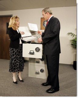 President George W. Bush tours the Treasury Agency's Bureau of Public Debt, with Director Susan Chapman, in Parkersburg, W.Va., Tuesday, April 5, 2005.  White House photo by Paul Morse