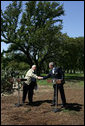 Israeli Prime Minister Ariel Sharon and President George W. Bush shake hands during a press conference at the President's Ranch in Crawford, Texas, Monday, April 11, 2005. White House photo by David Bohrer