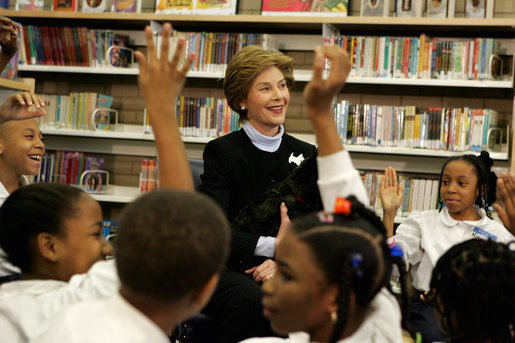 Laura Bush introduces her Scottish Terrier puppy Miss Beazley to fourth-grade students from Maury Elementary School during a visit to the Martin Luther King Jr. Memorial Library in Washington, D.C., Tuesday, April 12, 2005. White House photo by Krisanne Johnson