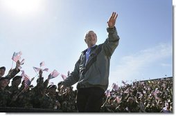 President George W. Bush receives a rousing Fort Hood welcome Tuesday, April 12, 2005, as he arrived at the base to thank the troops for their service and sacrifice in Iraq. "Whether you're coming or going, you are making an enormous difference for the security of our nation and for the peace of the world," the President said.  White House photo by Eric Draper