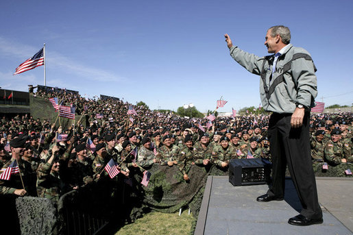 President George W. Bush waves to the troops at Fort Hood, Texas, as he arrived Tuesday, April 12, 2005, to thank them in person for their service in Iraq. "Americans are grateful for your sacrifice and your service," the President told a large portion of the 44,188 soldiers and airmen stationed at the base. ".And so is your Commander-in-Chief." White House photo by Eric Draper