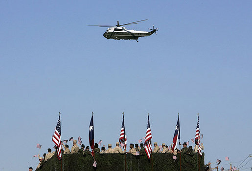 Marine One hovers above the troops at Fort Hood, Texas, as President George W. Bush arrived Tuesday, April 12, 2005. "It's an honor to be with the courageous men and women of the "Phantom Corps," the President told the troops. White House photo by Eric Draper