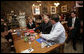 President George W. Bush talks with patrons at a coffee shop in Mentor, Ohio, April 15, 2005. White House photo by Paul Morse