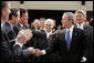 President George W. Bush greets South Carolina legislators upon his arrival to the State House in the state capitol Monday, April 18, 2005.White House photo by Paul Morse