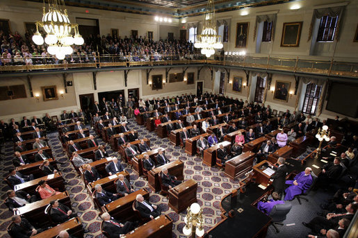 President George W. Bush addresses South Carolina legislators at the State House in Columbia Monday, April 18, 2005. "I found this to be an interesting statistic about your state: More than 76 percent of the people in your state own their own home, one of the highest rates in the United States. Small businesses are investing and expanding, exports are on the rise. Thanks to your leadership, thanks to your hard work, thanks to your willingness to set aside partisan differences, jobs are coming back to the great state of South Carolina," said the President. White House photo by Paul Morse