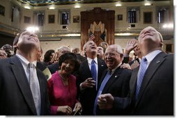 President George W. Bush wades into a crowd of legislators at the State House in Columbia, S.C., Monday, April 18, 2005.  White House photo by Paul Morse