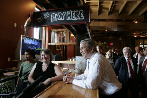 President George W. Bush spends time with employees of the Rockaway Athletic Club after addressing state legislators in Columbia, S.C., April 18, 2005. White House photo by Paul Morse