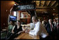 President George W. Bush spends time with employees of the Rockaway Athletic Club after addressing state legislators in Columbia, S.C., April 18, 2005. White House photo by Paul Morse