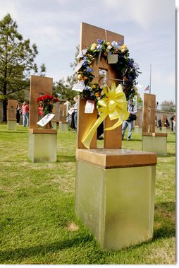 Flowers and personal items are left on several of the 168 memorial chairs at the Oklahoma City National Memorial on the 10th anniversary of the bombing of the Alfred P. Murrah Federal Building in Oklahoma City, Okla. The chairs stand in remembrance of the 168 people who died from the April 19, 1995 terrorist attack.  White House photo by David Bohrer