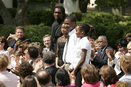 From left: Wendall Jefferson, Ta-Sha Watkins, Marco Jeter and Brandy Beaman receive applause as they stand after being acknowledged by their math teacher, Jason Kamras, the 2005 National Teacher of the Year, during ceremonies at the Rose Garden. White House photo by Krisanne Johnson