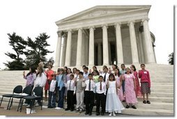 Laura Bush and Secretary of Interior Gail Norton joins Guilford Elementary School students in taking the Junior Ranger pledge from National Park Service Director Fran Mainella during an event at the Thomas Jefferson Memorial in Washington, D.C., April 21, 2005.  White House photo by Paul Morse