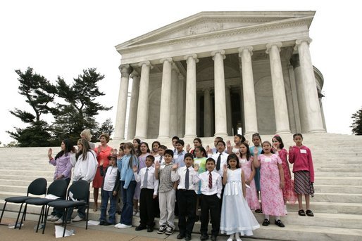 Laura Bush and Secretary of Interior Gail Norton joins Guilford Elementary School students in taking the Junior Ranger pledge from National Park Service Director Fran Mainella during an event at the Thomas Jefferson Memorial in Washington, D.C., April 21, 2005. White House photo by Paul Morse