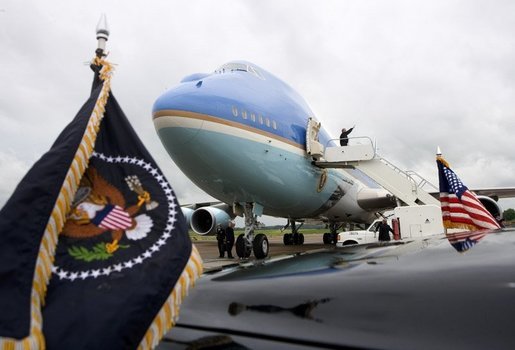 President George W. Bush waves goodbye while boarding Air Force One before departing McGhee Tyson Air National Guard Base in Knoxville en route to his ranch in Crawford, Texas, Friday, April 22, 2005. White House photo by Eric Draper