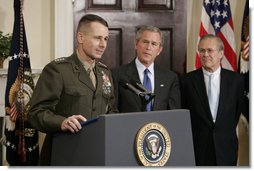 Gen. Peter Pace addresses the media as President George W. Bush and Secretary of Defense Donald Rumsfeld look on Friday, April 22, 2005. The President announced his nomination of Gen. Pace to be Chairman of the Joint Chiefs of Staff, saying, "When confirmed by the Senate, General Pete Pace will be the first Marine in history to hold this vital position. He knows the job well." White House photo by Paul Morse