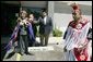 Laura Bush wears a traditional Native American wrap as she watches a musical performance before touring the Native American Community Health Center in Phoenix, Ariz., April 26, 2005. White House photo by Krisanne Johnson