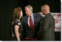  President George W. Bush greets Galveston County Employees Bea Bentley and her husband Christopher at the end of a roundtable discussion on Strengthening Social Security at the University of Texas Medical Branch in Galveston, Texas, Tuesday, April 26, 2005.  White House photo by Eric Draper