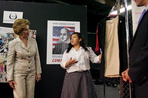 Laura Bush looks at costumes designed by members of the Will Power to Youth program before watching a performance of "Romeo and Juliet" at the Shakespeare Festival/LA's theater in Los Angeles April 26, 2005. Students in the program write their own versions of Shakespeare's plays, create the music, costumes and construct the sets for each production. White House photo by Krisanne Johnson