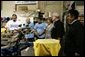 Laura Bush watches a silkscreen demonstration during a tour of Homeboy Industries in Los Angeles April 27, 2005. White House photo by Krisanne Johnson