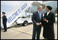 President George W. Bush meets Freedom Corps Greeter Ruth Wilson at Mississippi Air National Guard Base, Tuesday, May 3, 2005. Wilson developed a leadership training program at Mount Wade Missionary Baptist Church in Terry, Mississippi, to identify and meet needs within the community. White House photo by Eric Draper