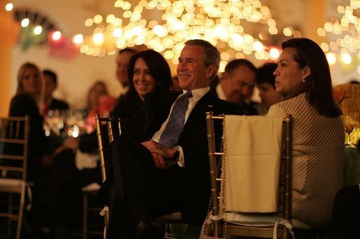 President George W. Bush listens to a mariachi band perform during the White House celebration of Cinco de Mayo in the Rose Garden of the White House Wednesday, May 4, 2005. White House photo by Paul Morse