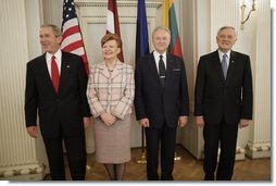 President George W. Bush stands with Latvia's President Vaira Vike-Freiberga, Estonia President Arnold Ruutel and Lithuania President Valdas Adamkus for a photo Saturday, May 7, 2005, in Riga, Latvia.  White House photo by Eric Draper