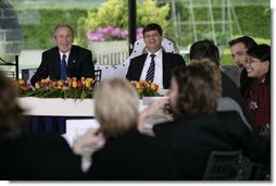 President George W. Bush and Prime Minister Jan Peter Balkenende of The Netherlands, smile as they answer questions during a youth roundtable Sunday, May 8, 2005, in Valkenburg, Netherlands.  White House photo by Eric Draper