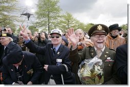 World War II veterans acknowledge President and Mrs. Bush Sunday, May 8, 2005, during a celebration at the Netherlands American Cemetery in Margraten, in remembrance of those who served during World War II.  White House photo by Eric Draper