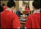 President George W. Bush signs notes to recipients of the 2005 MATHCOUNTS National Competition award during their visit to the Oval Office Thursday, May 12, 2005. White House photo by Paul Morse