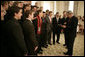 President George W. Bush talks with members of the Indiana University men's soccer team in the State Dining Room before a ceremony celebrating the 2005 NCAA champions Friday, May 13, 2005. White House photo by Eric Draper