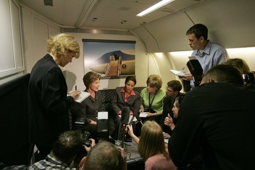 Laura Bush talks with members of the press pool aboard Air Force One during a flight to Amman, Jordan, Thursday, May 19, 2005. White House photo by Krisanne Johnson