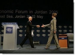 Klaus Schwab, chairman and founder of the World Economic Forum, welcomes Laura Bush to speak at the World Economic Forum at the Dead Sea in Jordan Saturday, May 21, 2005.  White House photo by Krisanne Johnson