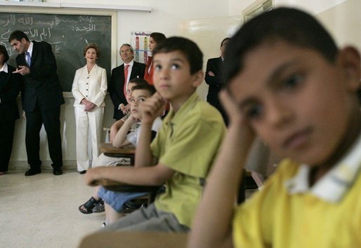 Laura Bush joins students in watching a kids educational program at the Discovery School of Swaifiyeh Secondary School in Amman, Jordan, Sunday, May 22, 2005. White House photo by Krisanne Johnson