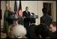 President George W. Bush and Afghan President Hamid Karzai field a question from a reporter Monday, May 23, 2005 in the East Room of the White House. White House photo by Eric Draper