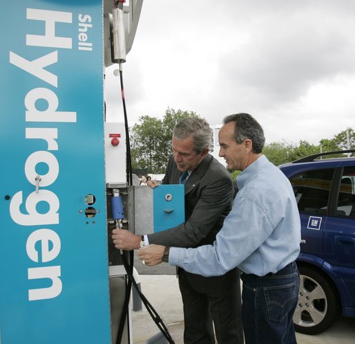 With the help of Rick Scott, Operations and Safety Coordinator, Shell Hydrogen, L.L.C., President George W. Bush replaces a nozzle on a hydrogen fueling pump at a Shell station in Washington D.C. The President visited the station, the first integrated gasoline/hydrogen station in North America, Wednesday, May 25, 2005, for a demonstration of its functions. White House photo by Paul Morse