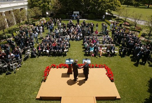 President George W. Bush and President Mahmoud Abbas of the Palestinian Authority, shake hands after a joint press availability in the Rose Garden of the White House Thursday, May 26, 2005. White House photo by Paul Morse