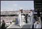 After addressing the Midshipmen and their families, President George W. Bush greets each graduate as they receive their diplomas during the U.S. Naval Academy graduation in Annapolis, Md., Friday, May 27, 2005. White House photo by Paul Morse