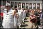 Thousands stand for the National Anthem during a Memorial Day ceremony at Arlington National Cemetery in Arlington, Va., May 30, 2005. White House photo by Krisanne Johnson