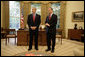 President George W. Bush stands with Rep. Christopher Cox, his nominee for Chairman of the Securities and Exchange Commission, Thursday, June 2, 2005, in the Oval Office. Said the President of the Congressman, "As a champion of the free enterprise system in Congress, Chris Cox knows that a free economy is built on trust." White House photo by Eric Draper