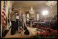 President George W. Bush and Laura Bush listen to performers during the White House reception honoring June as Black Music Month in the East Room Monday, June 6, 2005. Gospel artists Smokie Norful, Mary Mary and Reverend Donnie McClurkin performed during the ceremony. White House photo by Paul Morse