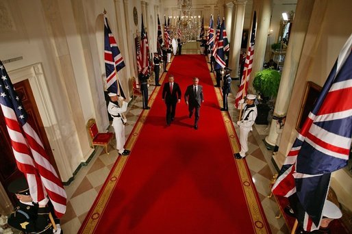 President George W. Bush and British Prime Minister Tony Blair walk together to address the waiting press in the East Room Tuesday, June 7, 2005. "Together our two nations worked to liberate Europe from fascism; together we defended freedom during the Cold War," President Bush in his statement. "Today we're standing together again to fight the war on terror, to secure democracy and freedom in Iraq and Afghanistan and the broader Middle East, and to prevent the spread of weapons of mass destruction." White House photo by Paul Morse