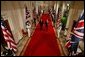 President George W. Bush and British Prime Minister Tony Blair walk together to address the waiting press in the East Room Tuesday, June 7, 2005. "Together our two nations worked to liberate Europe from fascism; together we defended freedom during the Cold War," President Bush in his statement. "Today we're standing together again to fight the war on terror, to secure democracy and freedom in Iraq and Afghanistan and the broader Middle East, and to prevent the spread of weapons of mass destruction." White House photo by Paul Morse