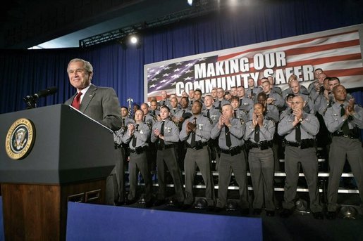 President George W. Bush receives a standing ovation from members of the Ohio State Highway Patrol before delivering remarks on the Patriot Act at in Columbus, Ohio, Thursday, June 9, 2005. White House photo by Eric Draper