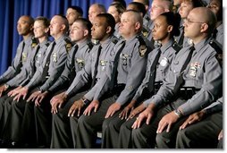 Members of the Ohio State Highway Patrol listen as President George W. Bush speaks about the Patriot Act at the Ohio State Highway Patrol Academy in Columbus, Ohio, Thursday, June 9, 2005. "Every day the men and women of law enforcement use the Patriot Act to keep America safe. It's the nature of your job that many of your most important achievements must remain secret," said the President in his remarks. "Americans will always be grateful for the risks you take, and for the determination you bring to this high calling."  White House photo by Eric Draper