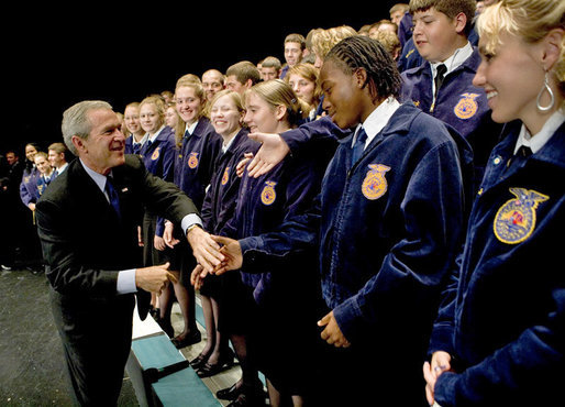 President George W. Bush greets members of the Pennsylvania FFA at their annual convention at Pennsylvania State University Tuesday, June 14, 2004. "I appreciate the fact that the Pennsylvania FFA has made a table for the Crawford, Texas FFA. I'm looking forward to telling the folks there at Crawford how decent the good folks here are in Pennsylvania, said President Bush." White House photo by Eric Draper