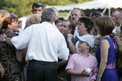 President George W. Bush meets with guests during the Congressional Picnic on the South Lawn Wednesday, June 15, 2005. White House photo by Paul Morse